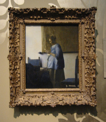 Johannes Vermeer's Woman in Blue Reading a Letter with frame